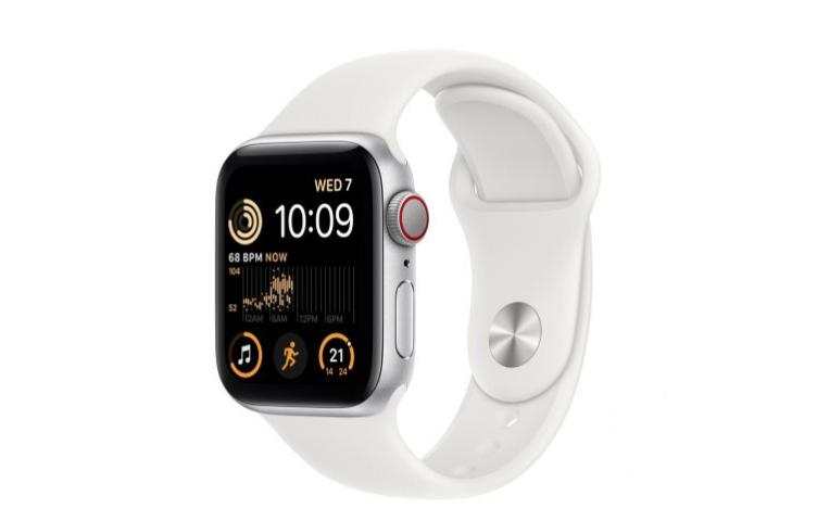 A white Apple Watch with a silver case displays the time, heart rate, and activity icons on its screen.